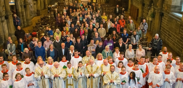 High angle ‘family’ view of clergy, servers, choir & congregation from rear balcony.
