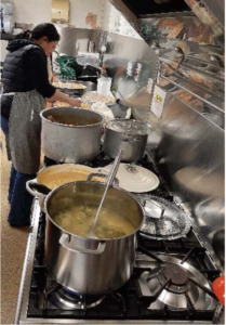 Photo showing pots of soup being cooked